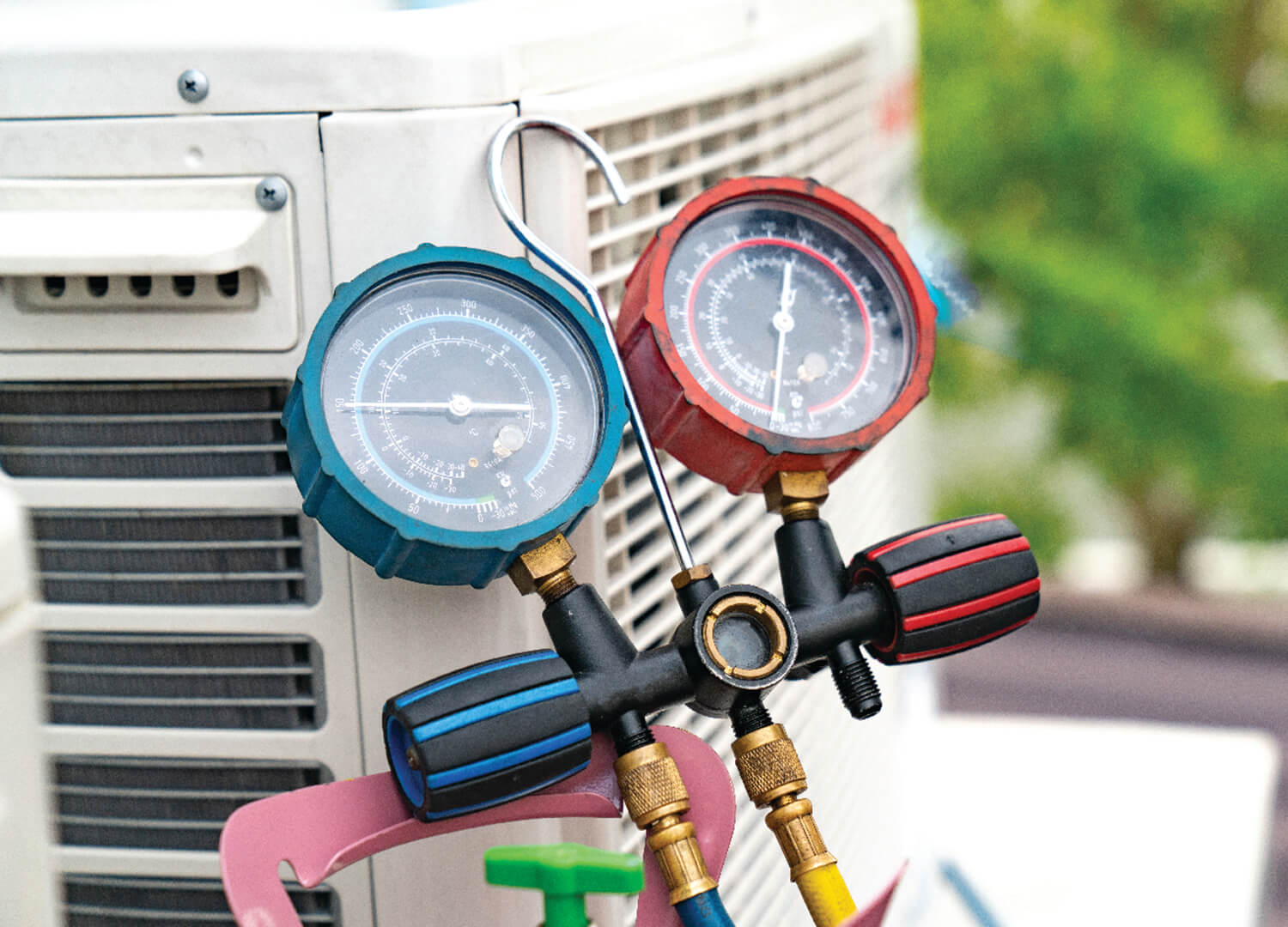 Guage measures pressure on an HVAC unit.